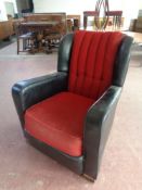 A 1930's black vinyl and fabric upholstered armchair