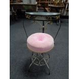 A wrought iron glass topped D shaped hall table together with a circular dressing table stool on