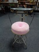 A wrought iron glass topped D shaped hall table together with a circular dressing table stool on