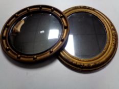 A circular gilt framed porthole mirror together with a further antique gilt framed mirror.