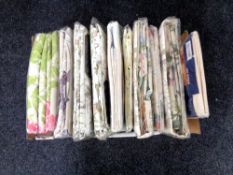 A box containing approximately ten sets of curtains (as new).