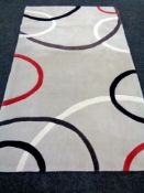 Five contemporary woolen rugs.