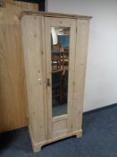 A Victorian pine mirror door wardrobe