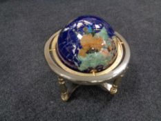 A Gemstone globe on stand, height 30 cm.