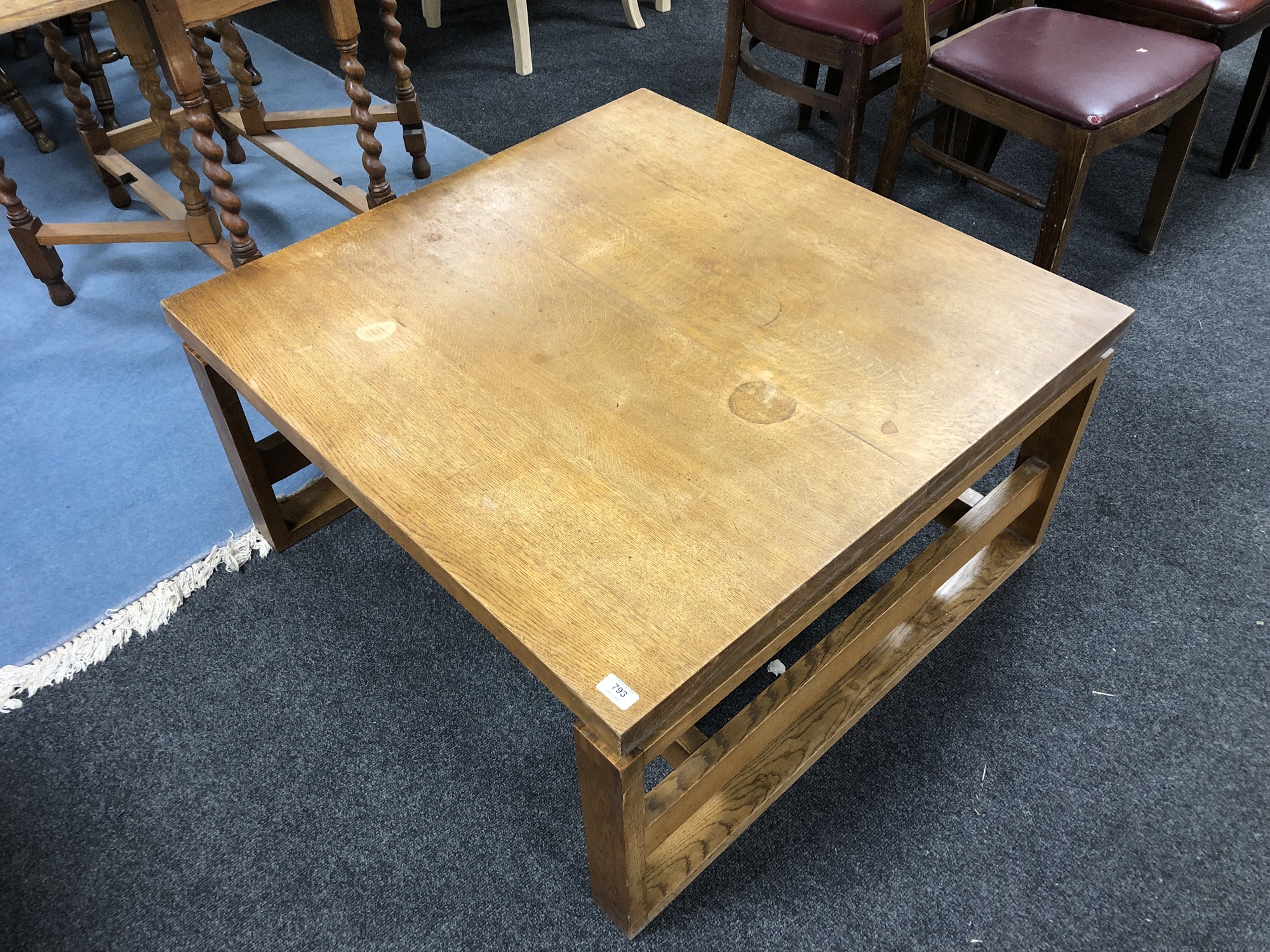 A square oak coffee table with under stretcher