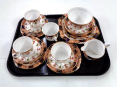 A tray containing 19 pieces of Colclough Imari patterned tea china.