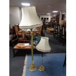 A brass standard lamp and shade,