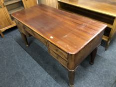 A continental mahogany five drawer writing desk