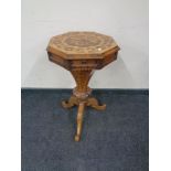 A Victorian inlaid rosewood pedestal work table