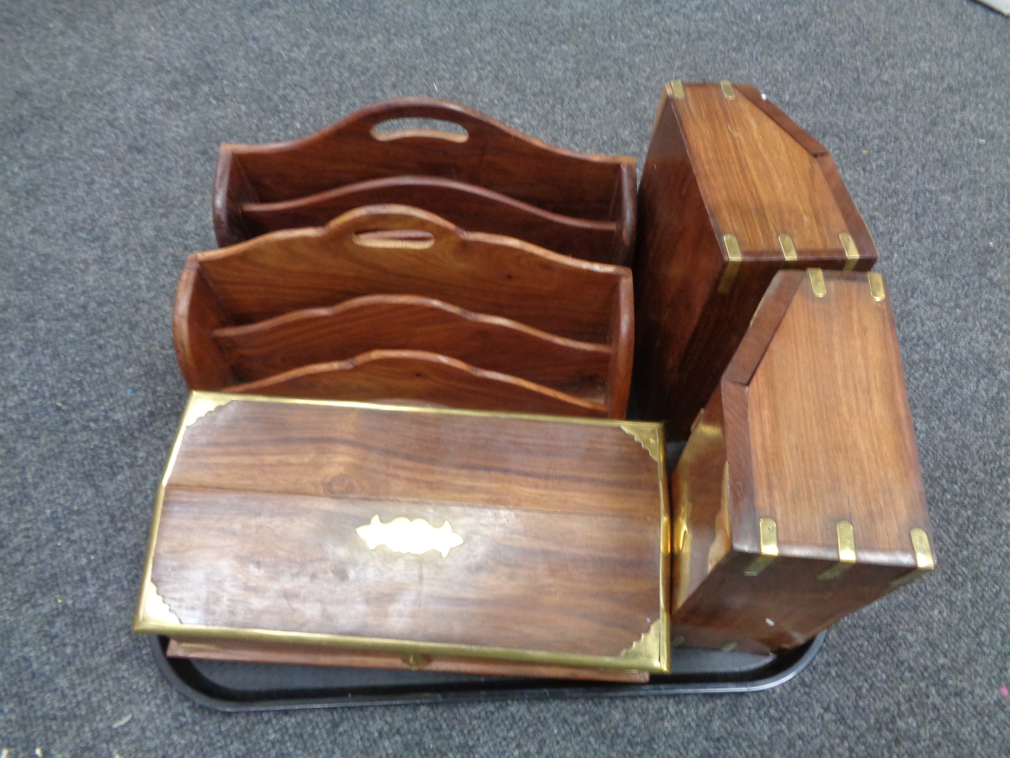 A tray containing three brass mounted hardwood storage boxes and two similar brass inlaid hardwood