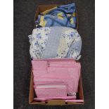 Three boxes containing quilts and other soft goods