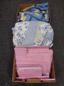 Three boxes containing quilts and other soft goods