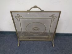 A Victorian brass fire guard