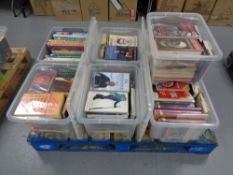A pallet containing approximately 7 boxes of books