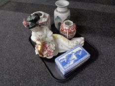 A tray containing porcelain figure of a geisha, oriental vases, blue and white lidded trinket box.