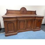 A Victorian mahogany inverted breakfront sideboard