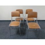 A set of four chrome and faux tan leather upholstered cafe chairs