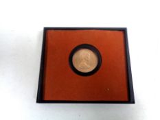 A gold $25 proof edition Cayman Island coin,
