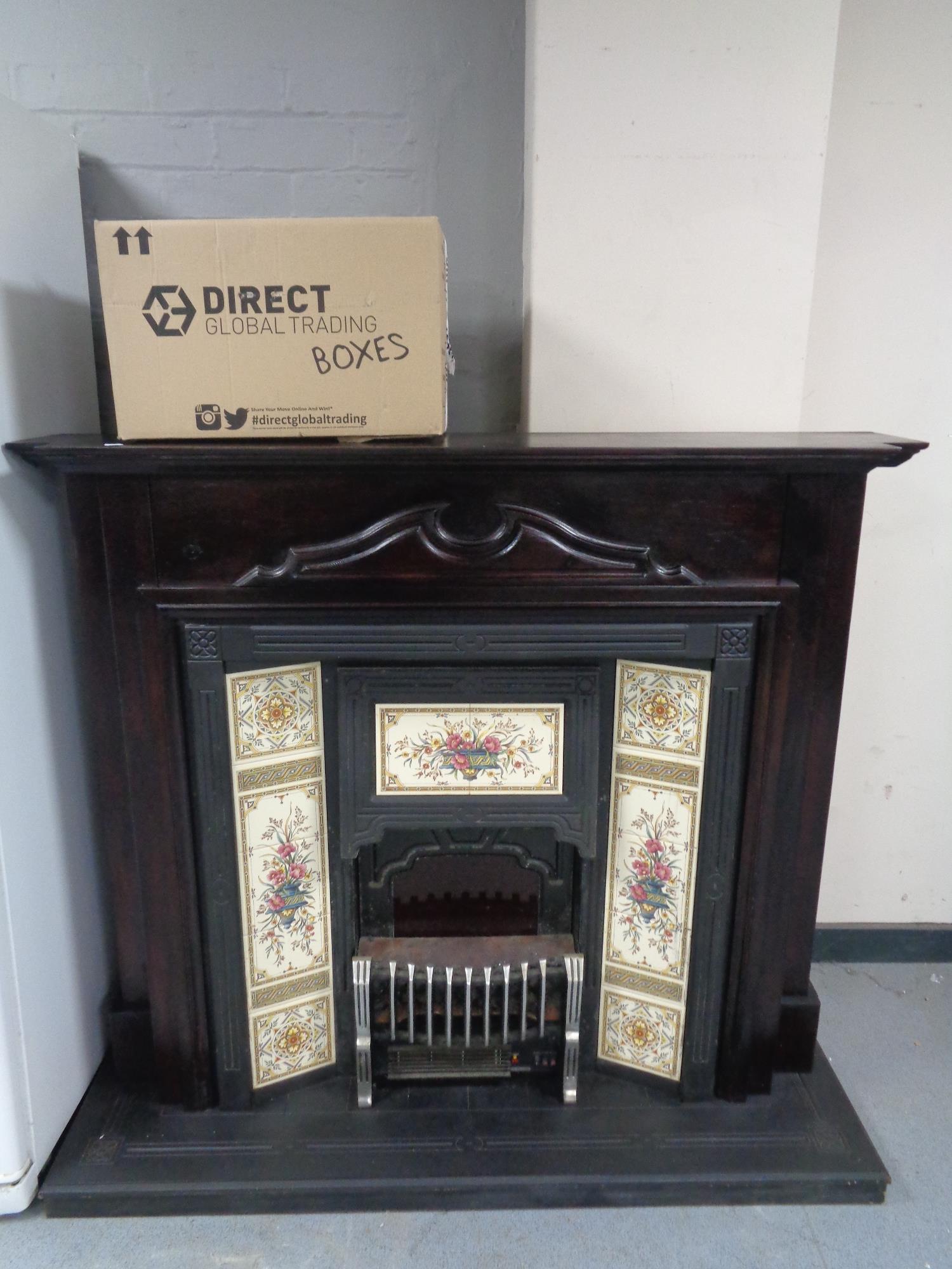 A contemporary fire surround with tiled insert
