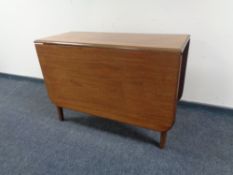 A mahogany drop leaf table