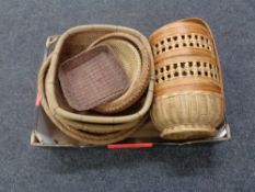A box containing a quantity of wicker baskets