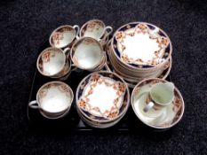 A tray containing approximately 38 pieces of antique Imari patterned tea china