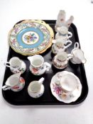 A tray containing Royal Worcester blush ivory plate, Royal Worcester miniature porcelain jugs,