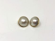 A pair of yellow gold mounted mabe pearl earrings