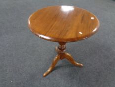 A 19th century mahogany tilt top pedestal occasional table