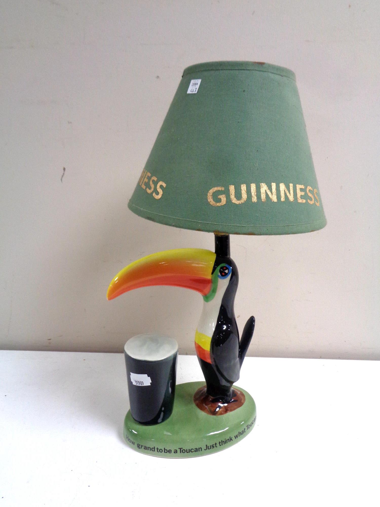 A Carlton ware Guinness toucan table lamp with shade