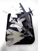 A tray containing three Corgi Aviation Archive die cast model aircraft on stands,