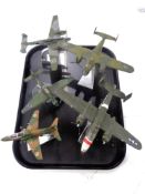 A tray containing four Corgi Aviation Archive die cast aircraft on stands,