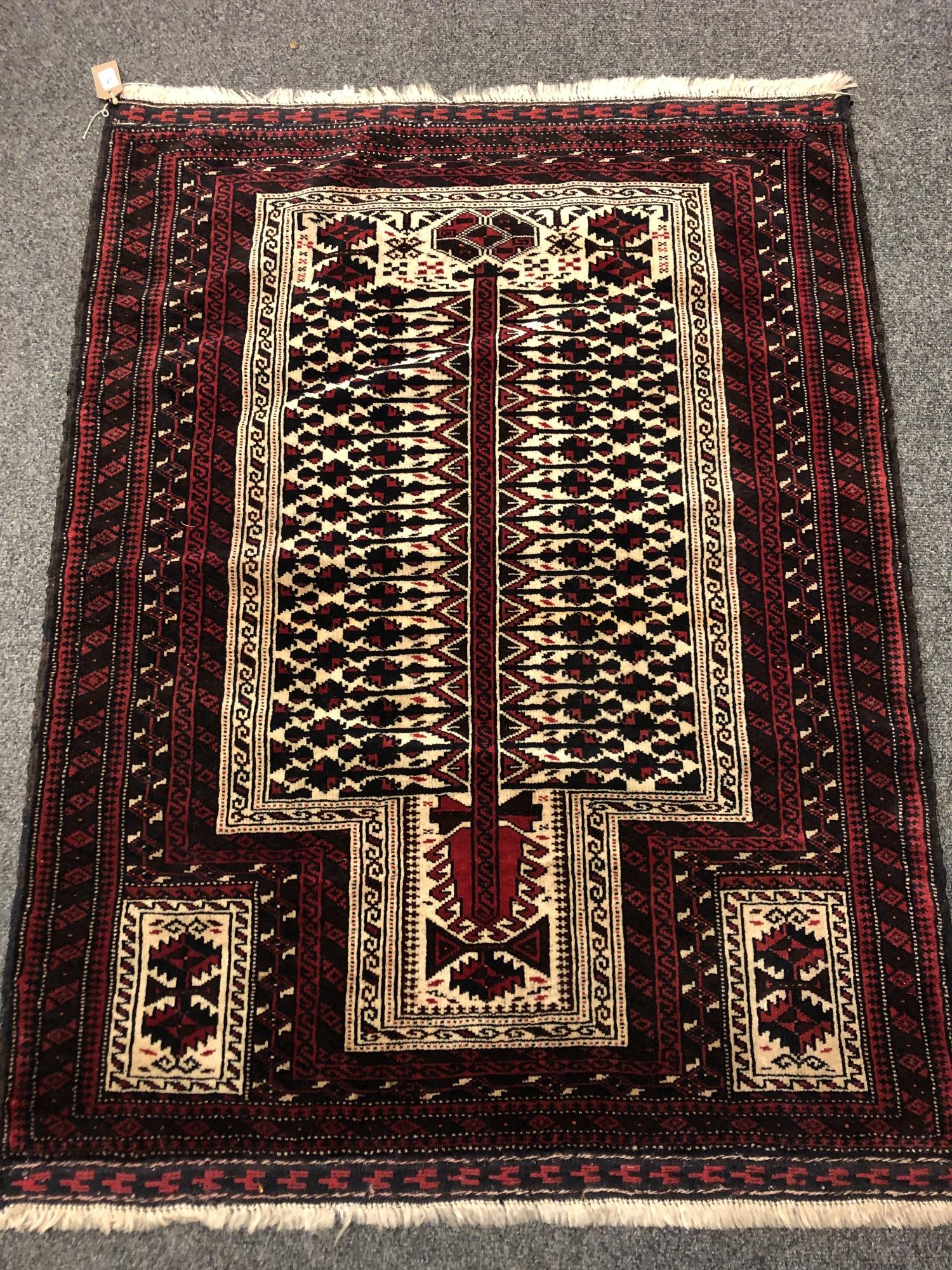 An Afghan prayer rug 131 x 100 cm