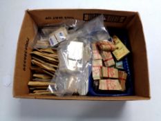 A box containing a very large quantity of boxed and loose cigarette cards
