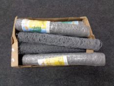 A box containing ten rolls of galvanized wire netting.