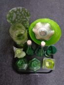 A tray containing green glassware including petrol glass dish, pair of bottles with stoppers,