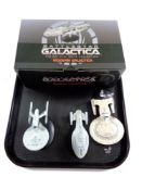 A tray containing boxed Battlestar Galactica die cast model and three further die cast models.