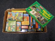 A box containing a large quantity of 20th century board games, World of Sport, Sixth Sense,