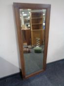 An oak framed rectangular bevel edged mirror