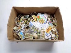 A box containing a very large quantity of loose cigarette cards