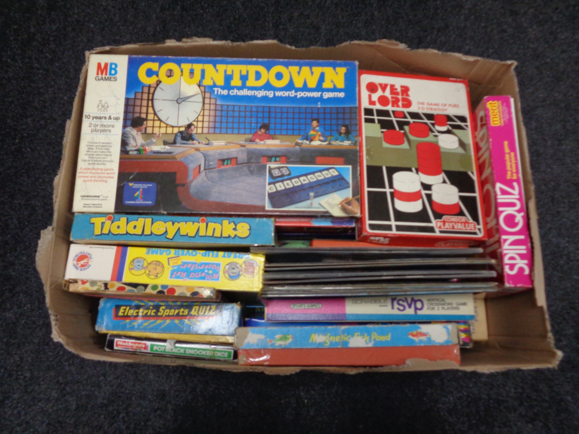 A box containing a large quantity of 20th century board games including Countdown, Overlord,