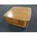 An Ercol elm Pandora's box coffee table