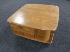 An Ercol elm Pandora's box coffee table