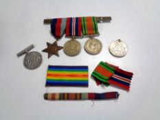 A group of four Second World War medals including Defence medals, 1939-1945 Star etc.