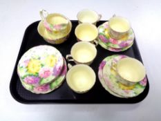 A tray containing 18 pieces of Crown Staffordshire floral decorated tea china.