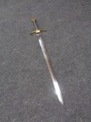 A reproduction brass handled broad sword