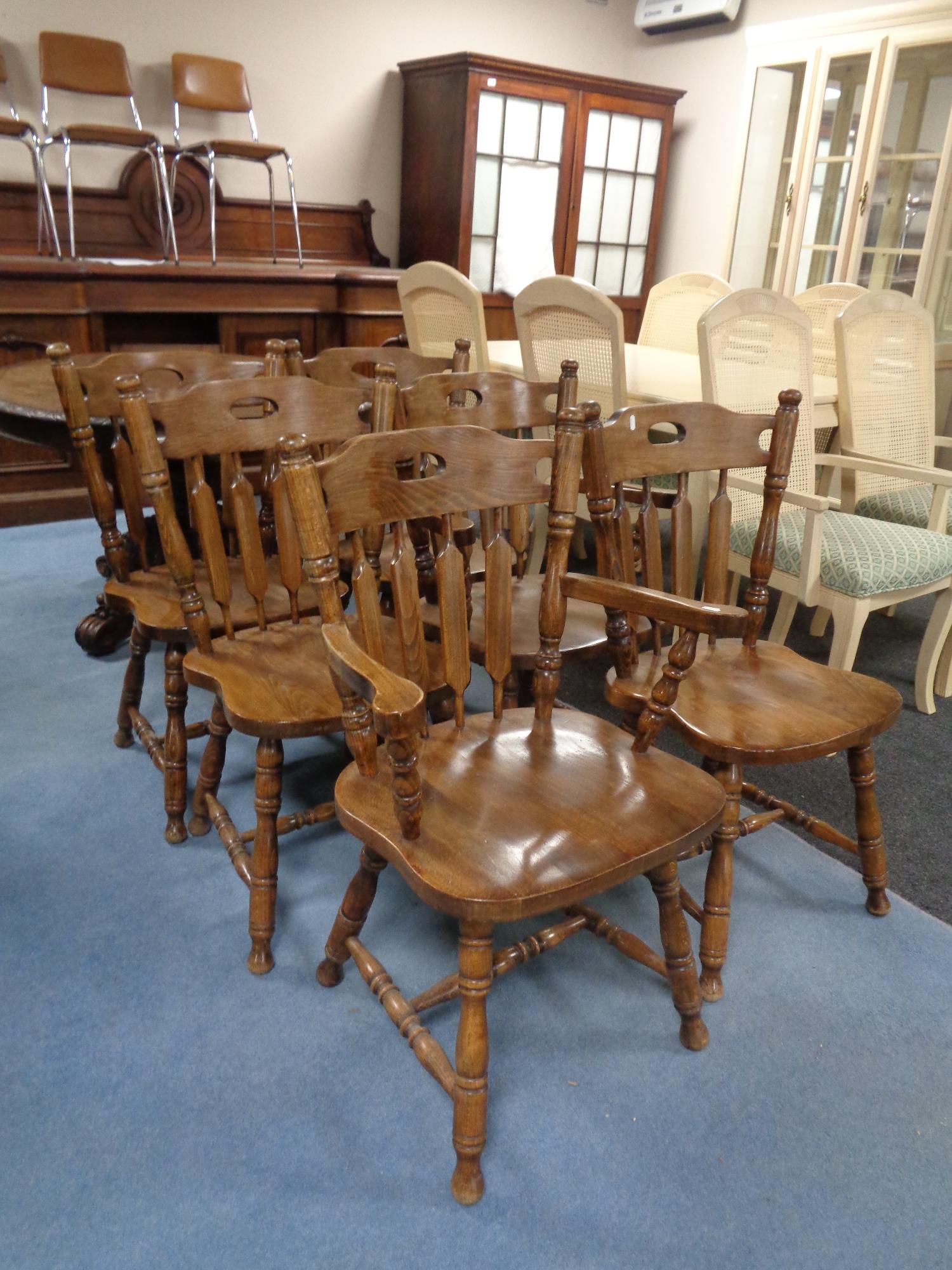 A set of six beech dining chairs comprising two carvers and four singles