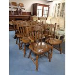 A set of six beech dining chairs comprising two carvers and four singles