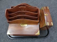 A tray containing two hardwood brass inlaid letter racks together with a brass mounted hardwood