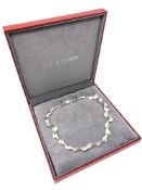 A Georg Jensen Sterling Silver Necklace, length 46 cm, in original retail box.